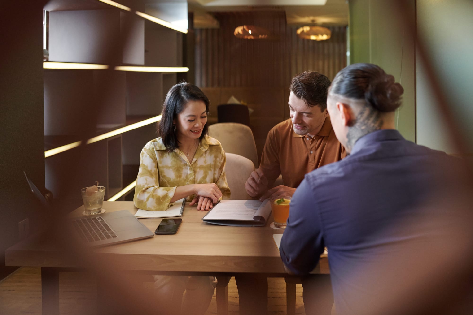 An adviser and a client talking across a desk